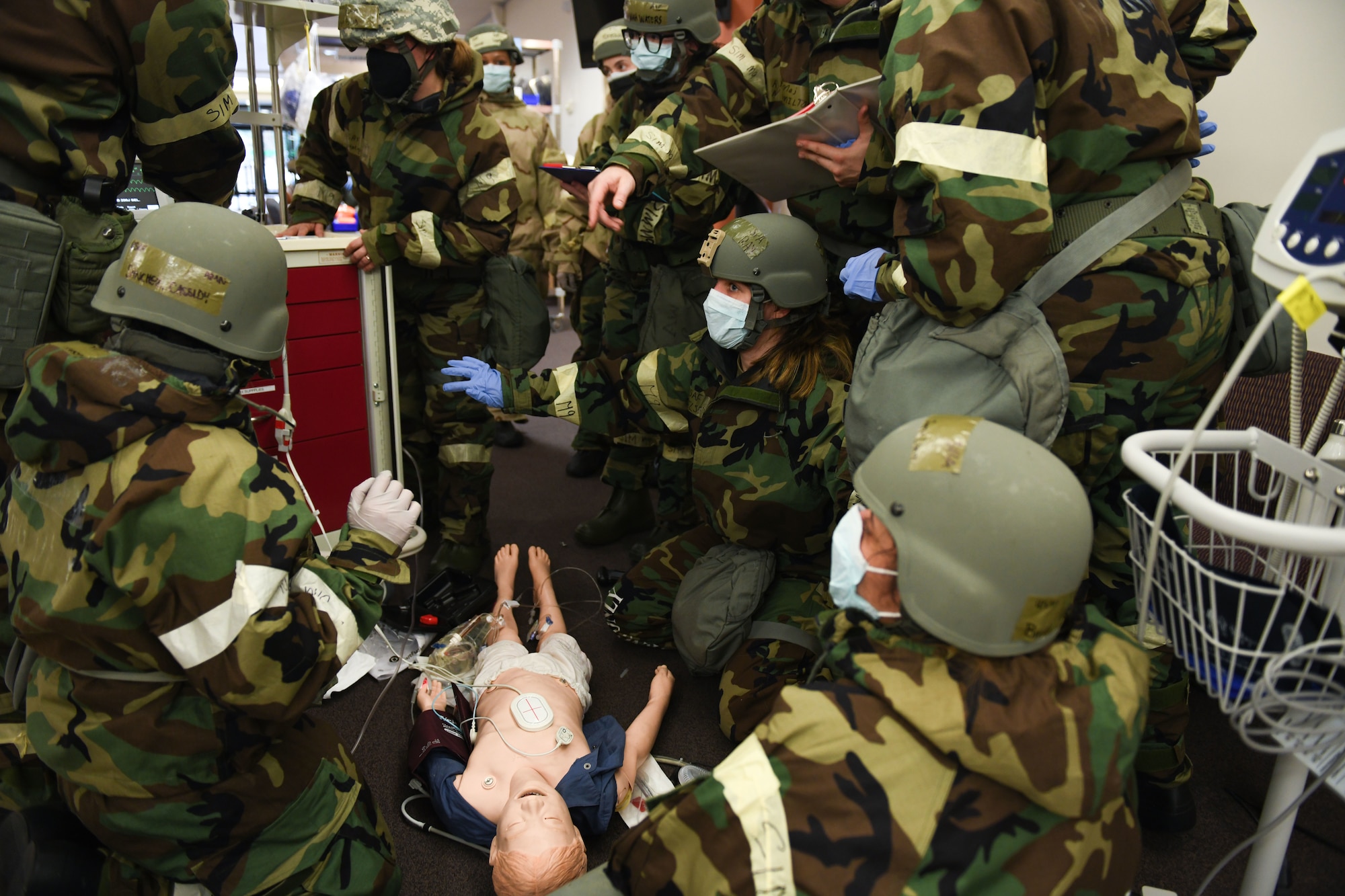 U.S. Airmen from the 31st Fighter Wing perform a code blue drill on a mannequin during an exercise at Aviano Air Base, Italy, April 12, 2021. Cardiac or respiratory arrest drills, known as code blue, are performed on mannequins to ensure proper readiness in the event of real-world, medical emergencies. (U.S. Air Force photo by Senior Airman Ericka A. Woolever)