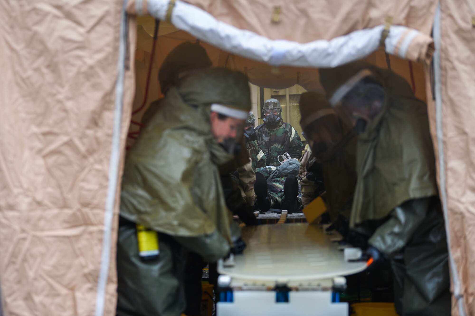 U.S. Airmen from the 31st Fighter Wing perform decontamination procedures
during a base defense readiness exercise at Aviano Air Base, Italy, April 12, 2021. The training was conducted to assess and improve the team’s proficiency in implementing and executing proper decontamination procedures in the event of a chemical, biological, radiological or nuclear incident. (U.S. Air Force photo by Senior Airman Ericka A. Woolever)