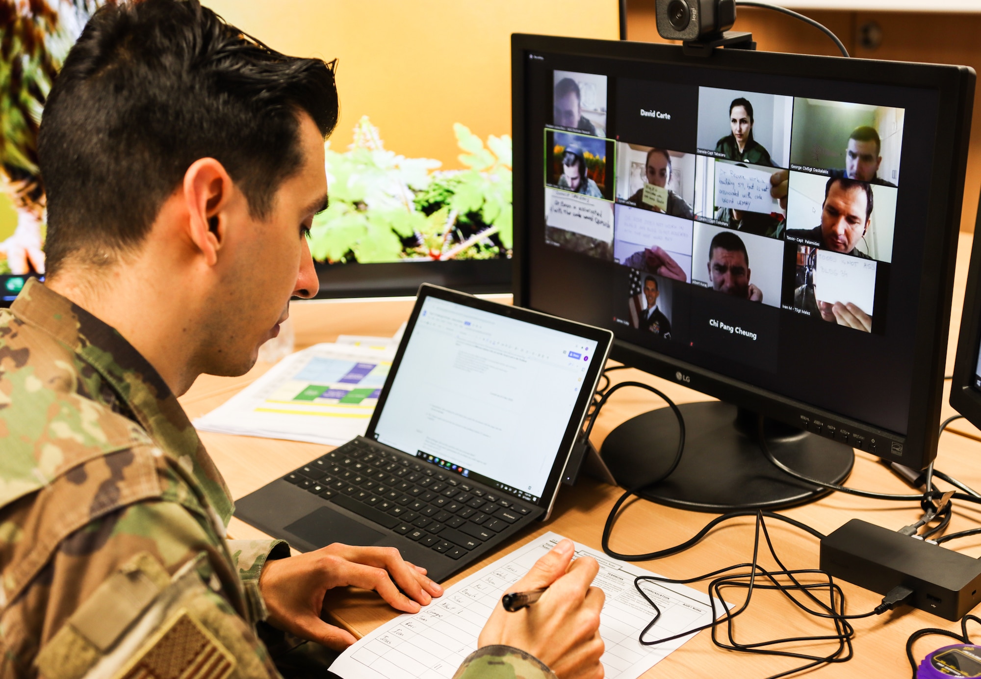 U.S. Air Force Capt. David Carte, Inter-European Air Forces Academy instructor, conducts a performance assessment of NATO students working through a virtual team building exercise at Kapaun Air Station, Germany, Feb. 25, 2021. The IEAFA students practiced principles of effective leadership they can apply daily in their own armed forces. (Courtesy photo by Inter-European Air Forces Academy)