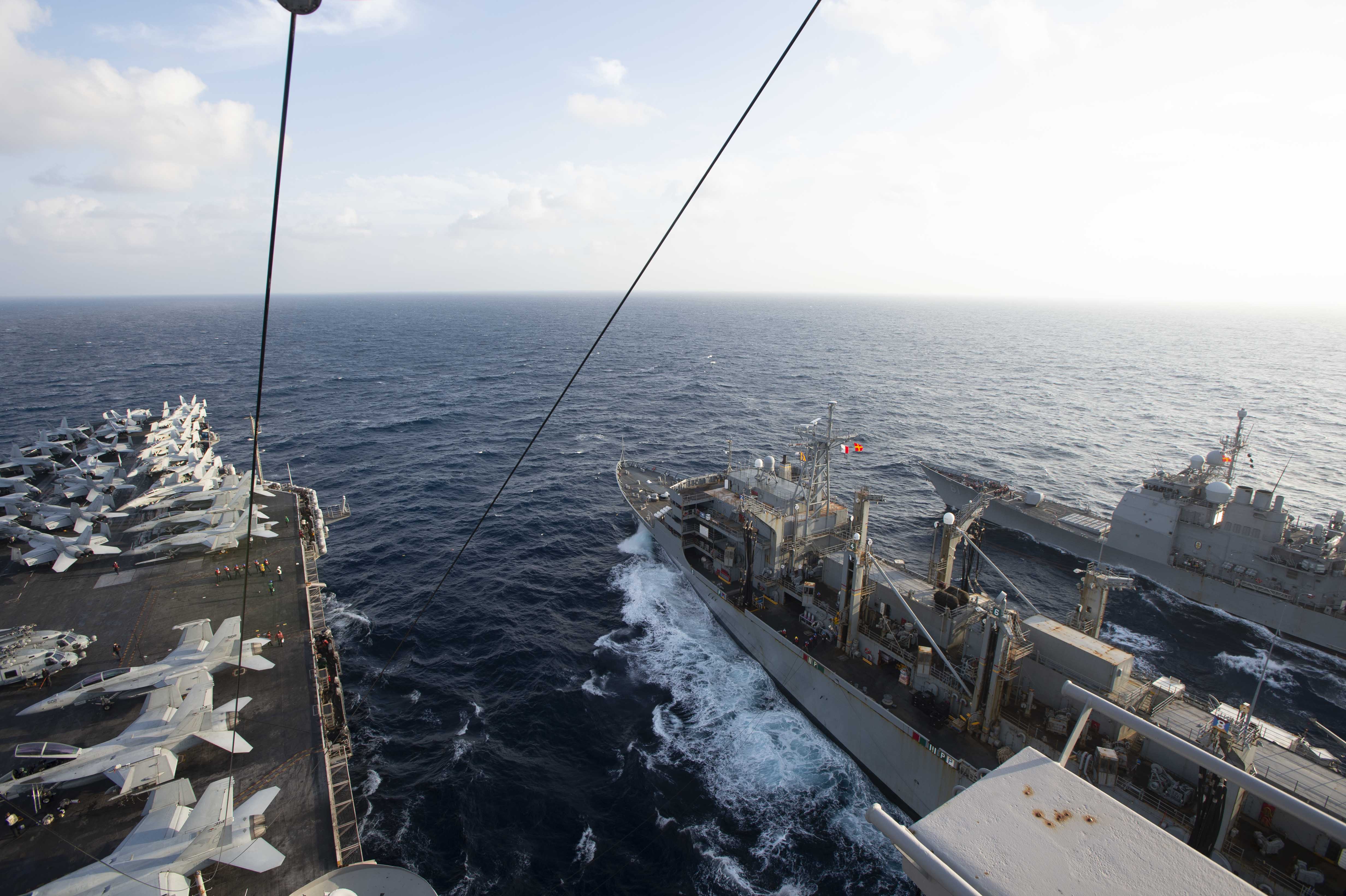 210307-N-YD547-2029 ATLANTIC OCEAN (March 7, 2021) The Nimitz-class aircraft carrier USS Dwight D. Eisenhower (CVN 69), left, conducts a replenishment-at-sea with the fast-combat support ship USNS Arctic (T-AOE 8), center, and the Ticonderoga-class guided-missile cruiser USS Monterey (CG 61), in the Atlantic Ocean, March 7, 2021. The IKE Carrier Strike Group is on a scheduled deployment in the U.S. Sixth Fleet area of operations in support of U.S. national interests and security in Europe and Africa. (U.S. Navy photo by Mass Communication Specialist Seaman Trent P. Hawkins/Released)