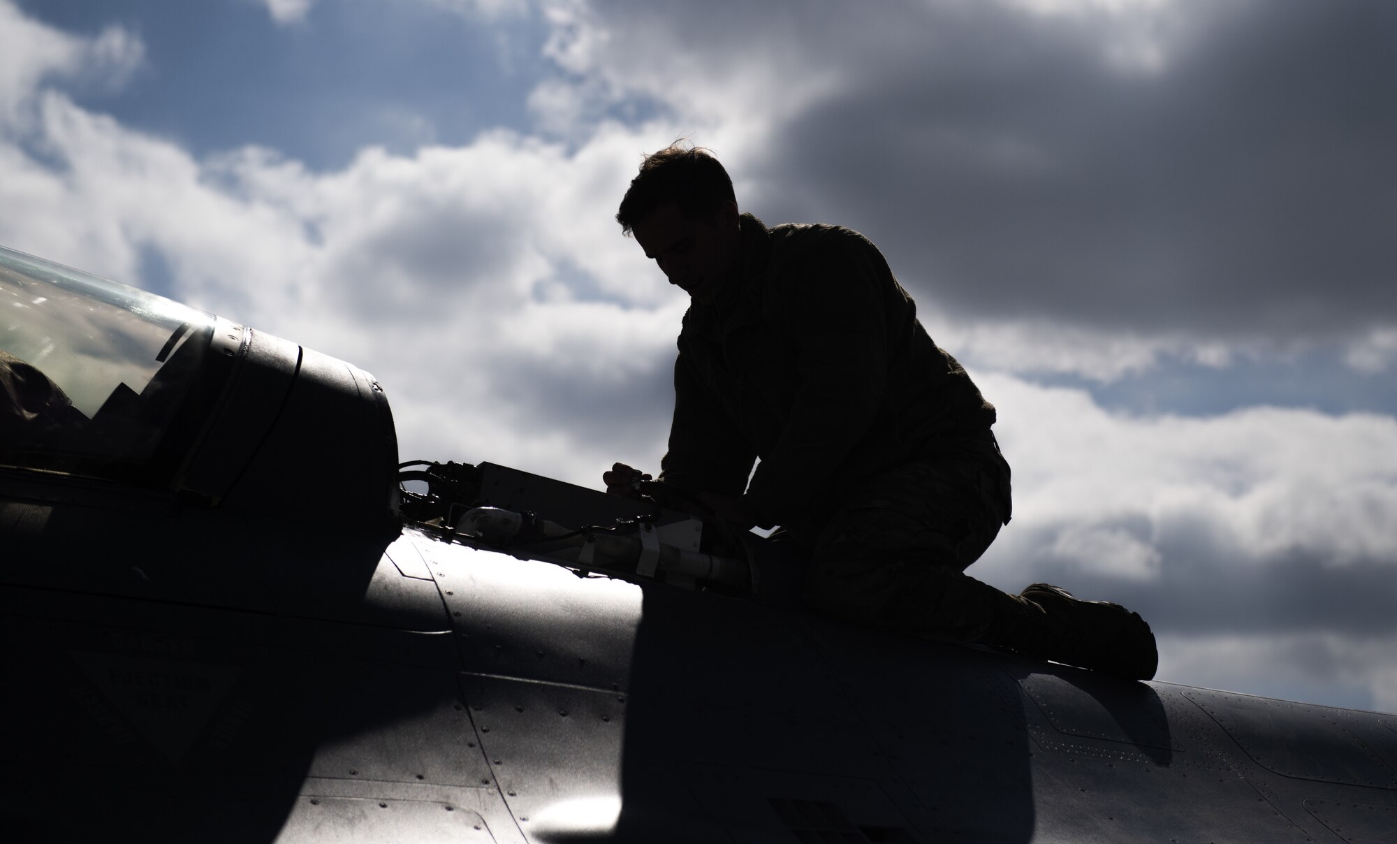 U.S. Air Force Staff Sgt. Kenneth Birkemeier, 52nd Aircraft Maintenance Squadron avionics specialist, performs a pre-flight inspection on a 480th Fighter Squadron F-16 Fighting Falcon at Spangdahlem Air Base, Germany, April 9, 2021. F-16s from Spangdahlem participated in a multi-day exercise, Point Blank 21-02, alongside aircraft from Royal Air Force Lakenheath, England, RAF Mildenhall, England, and the Royal Netherlands Air Force. (U.S. Air Force photo by Senior Airman Ali Stewart)