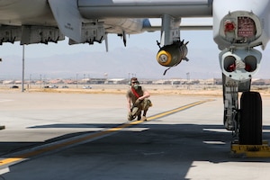 Airman 1st Class Dillon Terhaar, a crew chief with the Michigan Air National Guard’s 127th Wing, ensures that all tools are accounted for as 107th Fighter Squadron pilot Capt. Pete Taylor prepares for a training mission in an A-10 Thunderbolt II aircraft at Nellis Air Force Base, Nevada, April 12, 2021.