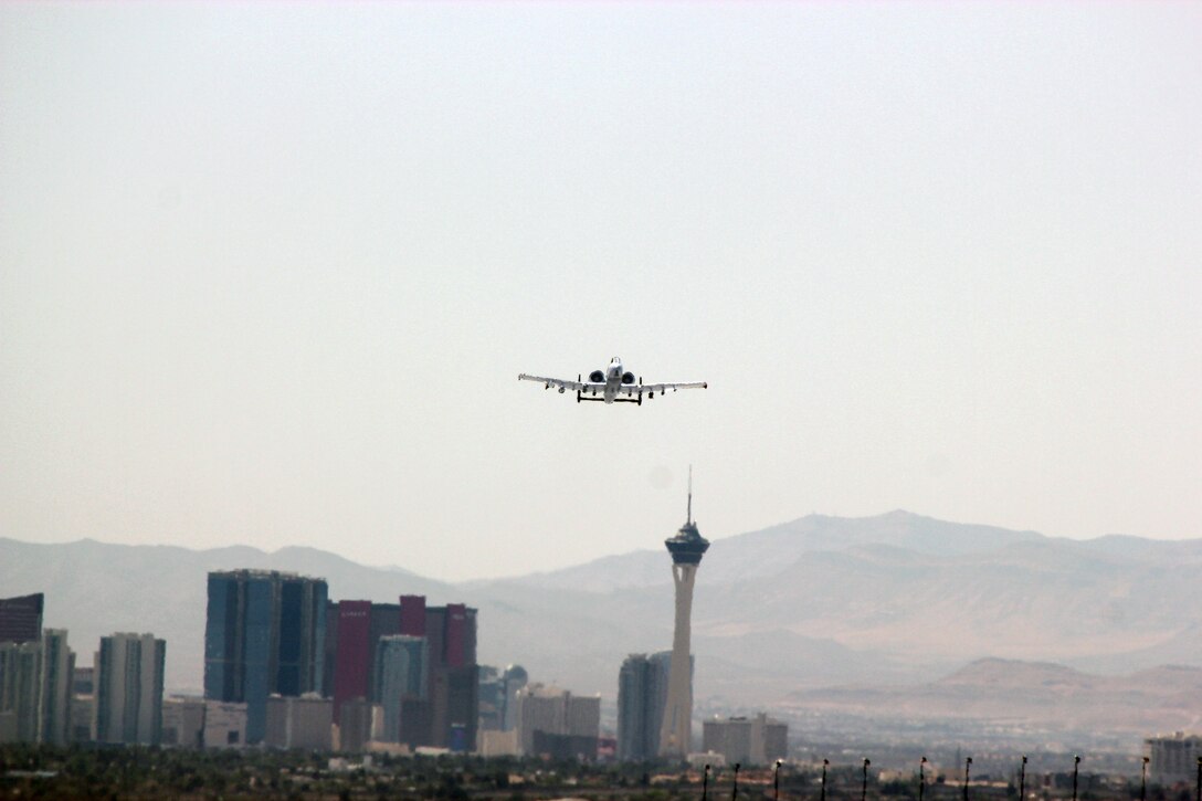 An A-10 Thunderbolt II aircraft from the Michigan Air National Guard’s 107th Fighter Squadron, 127th Wing, is seen in flight at Nellis Air Force Base, Nevada, April 12, 2021. The city of Las Vegas skyline can be seen in the background.