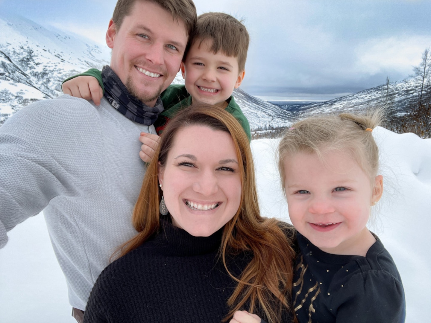 Petty Officer 1st Class Sarah Jacobs shares a moment with her family in Seward, Alaska, where the Jacobs family has enthusiastically embraced numerous outdoor activities. Jacobs credits her husband Brandon for supporting her thriving career. (U.S. Coast Guard photo)