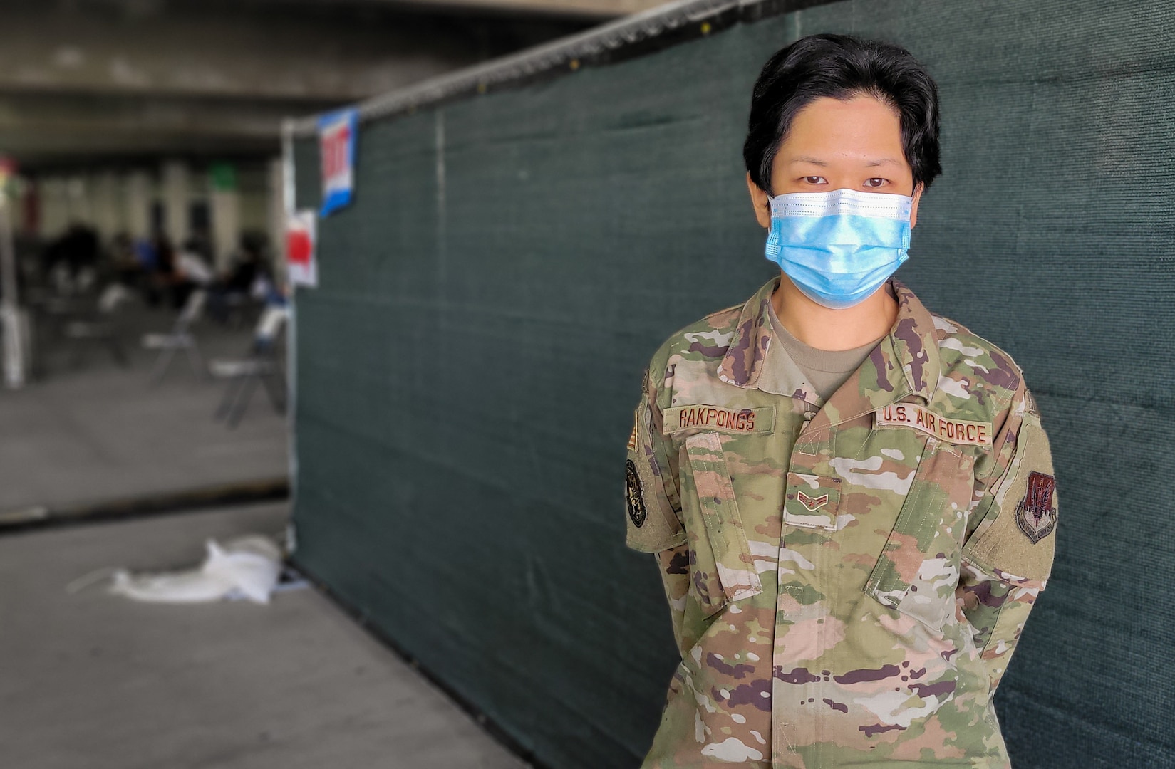 U.S. Air Force Airman 1st Class Piyaporn Rakpongs, a fleet management and analysis specialist with the 147th Combat Communications Squadron, California National Guard, monitors the walk-up site at the community vaccination center at California State University Los Angeles, March 8, 2021. Rakpongs grew up in Thailand before joining the Cal Guard.