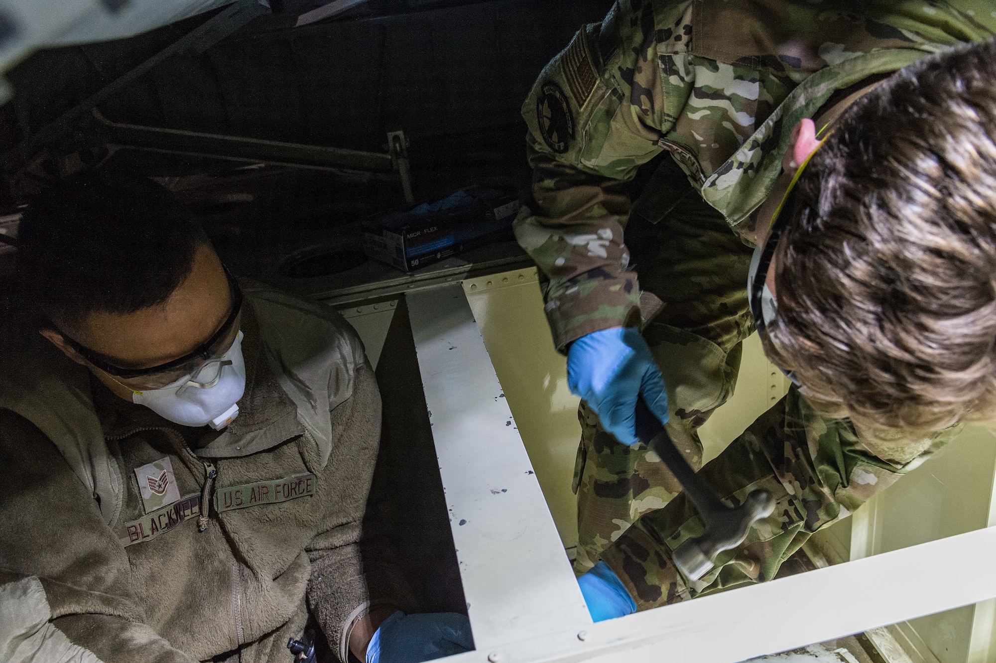 Staff Sgt. Konner Blackwell and Senior Airman Jack Ventrella, both 436th Maintenance Squadron aircraft structural maintenance journeymen, make repairs on a C-17 Globemaster III on Dover Air Force Base, Delaware, April 7, 2021. Blackwell and Ventrella repaired a crack on the C-17’s ramp number 2 bulkhead. (U.S. Air Force photo by Roland Balik)