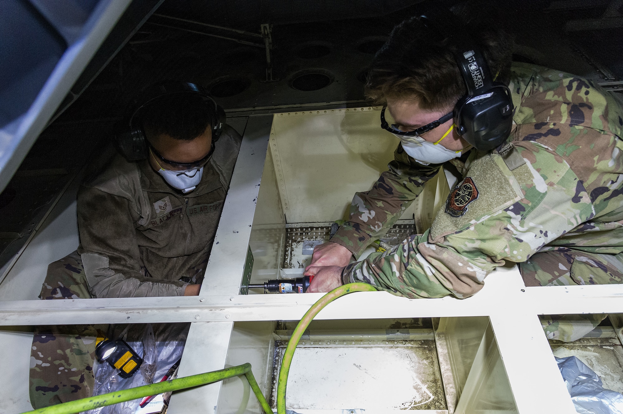 Staff Sgt. Konner Blackwell and Senior Airman Jack Ventrella, both 436th Maintenance Squadron aircraft structural maintenance journeymen, make repairs on a C-17 Globemaster III on Dover Air Force Base, Delaware, April 7, 2021. Blackwell and Ventrella repaired a crack on the ramp number 2 bulkhead. (U.S. Air Force photo by Roland Balik)