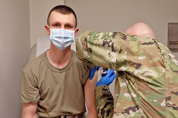 Tech. Sgt. Brian Faulkner, a Health Technician, with the 127th Medical Group, administers the COVID-19 vaccine. The 127th Wing began inoculating Airmen with the COVID-19 vaccine at Selfridge Air National Guard Base on Friday, Jan. 8. More than 60 personnel at the base, primarily Security Forces and medical personnel, were in the first wave to receive the shots, administered by the Wing’s medics.