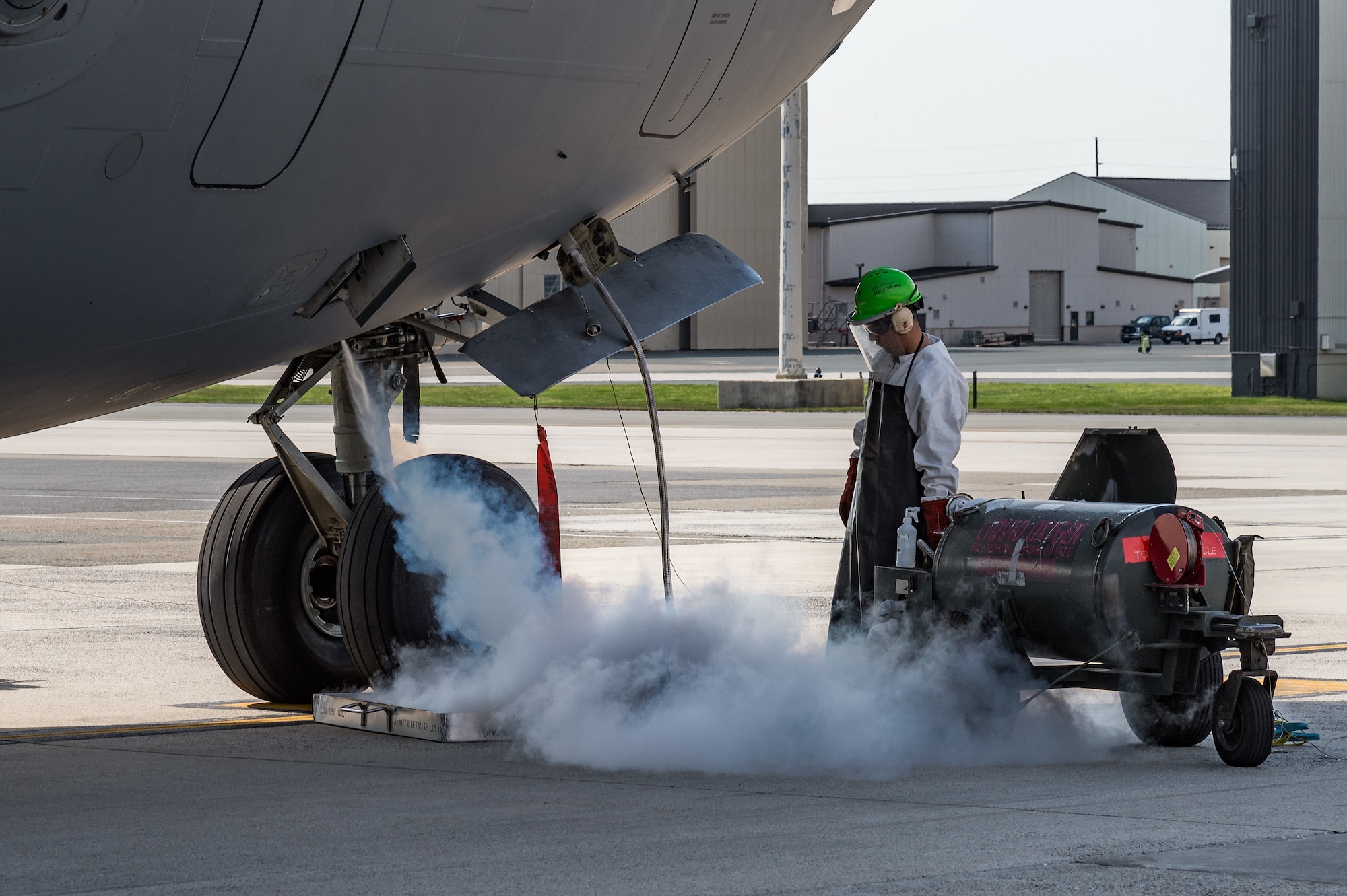 Senior Airman Anthony Enriquez, 736th Aircraft Maintenance Squadron crew chief, services a C-17 Globemaster III with liquid oxygen on Dover Air Force Base, Delaware, April 7, 2021. The C-17 is capable of rapid strategic delivery of troops and all types of cargo to main operating bases or directly to forward bases around the world. Thirteen C-17s are assigned to Dover AFB. (U.S. Air Force photo by Roland Balik)
