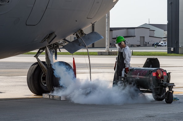 Senior Airman Anthony Enriquez, 736th Aircraft Maintenance Squadron crew chief, services a C-17 Globemaster III with liquid oxygen on Dover Air Force Base, Delaware, April 7, 2021. The C-17 is capable of rapid strategic delivery of troops and all types of cargo to main operating bases or directly to forward bases around the world. Thirteen C-17s are assigned to Dover AFB. (U.S. Air Force photo by Roland Balik)