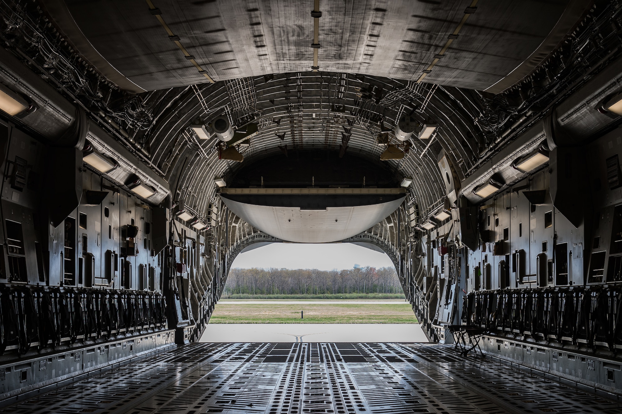The ramp of a C-17 Globemaster III is positioned in the drive-in mode on Dover Air Force Base, Delaware, April 7, 2021. The C-17 is the most flexible cargo aircraft to enter the airlift force. The C-17 is capable of rapid strategic delivery of troops and all types of cargo to main operating bases or directly to forward bases around the world. (U.S. Air Force photo by Roland Balik)