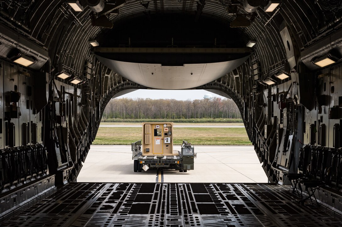 A Negatively Pressurized Conex waits to be loaded onto a C-17 Globemaster III on Dover Air Force Base, Delaware, April 7, 2021. The 775th Expeditionary Aeromedical Evacuation Flight conducted training that included decontamination procedures of the entire NPC. (U.S. Air Force photo by Roland Balik)