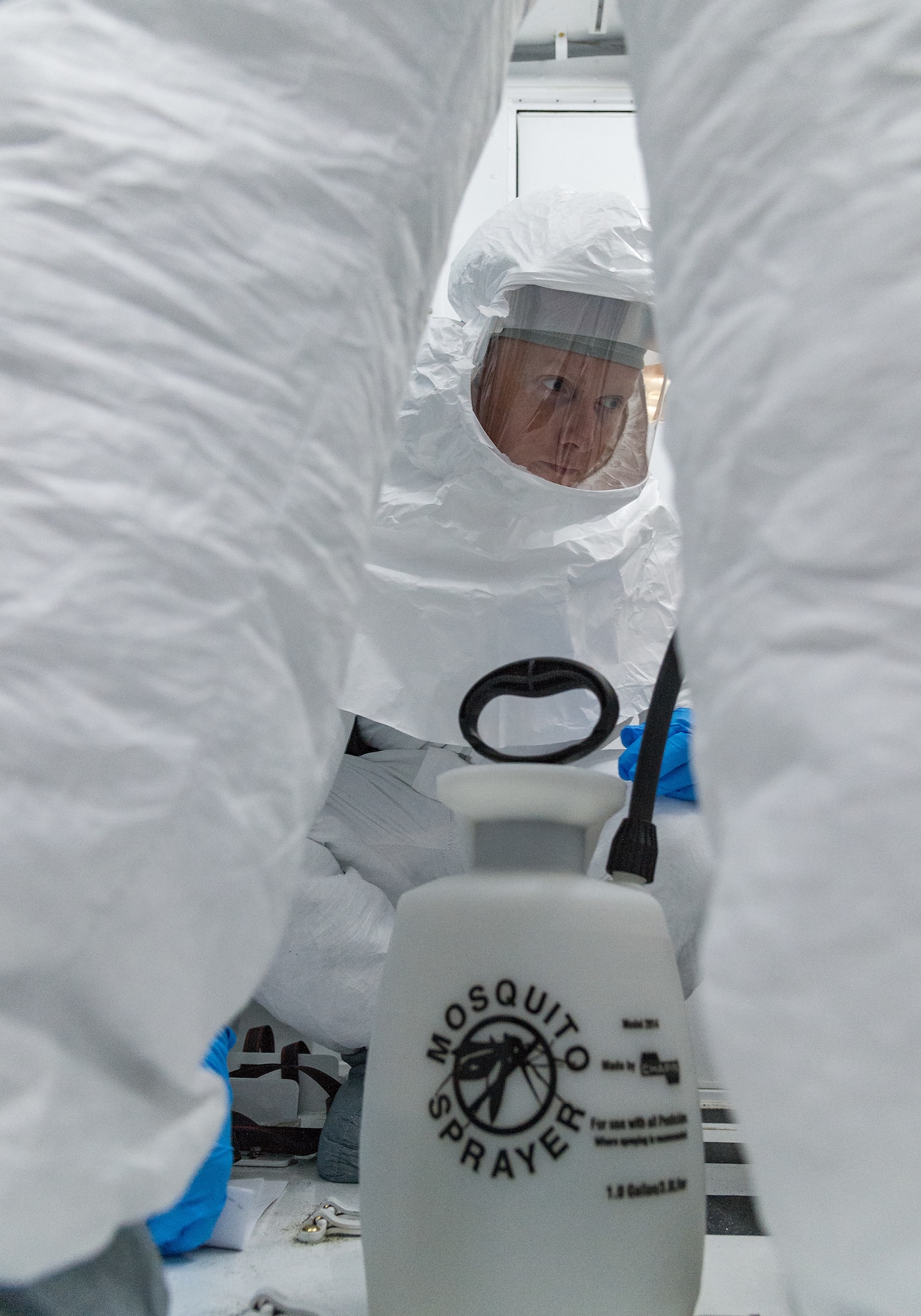 Staff Sgt. Beau Wilson, 5th Health Care Operations Squadron biomedical equipment technician, watches decontamination procedures of the Negatively Pressurized Conex loaded on a C-17 Globemaster III on Dover Air Force Base, Delaware, April 7, 2021. Wilson and other members of the 775th Expeditionary Aeromedical Evacuation Flight participated in NPC training that included decontamination procedures of the entire NPC. (U.S. Air Force photo by Roland Balik)