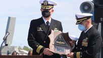 PORTSMOUTH, Va. (April 9, 2021) – Cmdr. Donald J. Curran III, left, and Cmdr. Sam T. Sareini, right, are presented with the Battle Effectiveness Award during the Arleigh Burke-class guided-missile destroyer USS Nitze’s change of command ceremony. Sareini was relieved by Curran during the ceremony. (U.S. Navy photo by Ens. William Fong/Released)