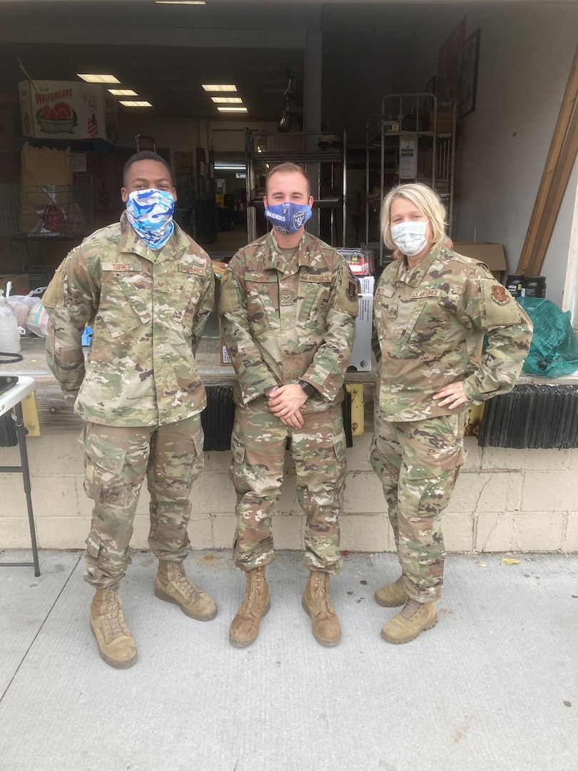 Senior Airman Terra Waitl, right, who is assigned to the 139th Logistics Readiness Squadron’s material management office, Missouri Air National Guard, stands outside the Nutrition Center in St. Joseph, Missouri, Nov. 12, 2020. The Missouri National Guard has been assisting at food banks across the state as part of Missouri’s COVID-19 response.