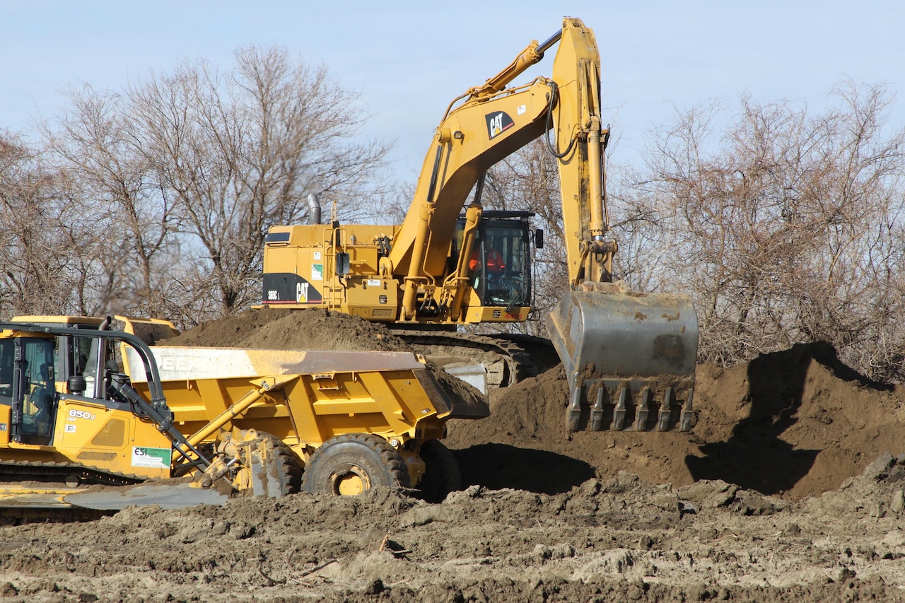 Heavy equipment moves earth.