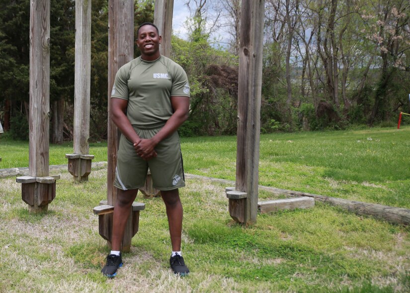 Capt. Donovan Holloway, an intelligence officer at Marine Corps Systems Command, demonstrates a prototype version of the new Physical Training Uniform, April 13.