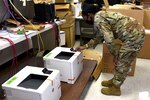 Air Force Staff Sgt. Tiffany Greene, 145th Communications Flight, obtains an IP address and re-images a printer at the North Carolina Air National Guard Base, Charlotte Douglas International Airport, April 11, 2021.