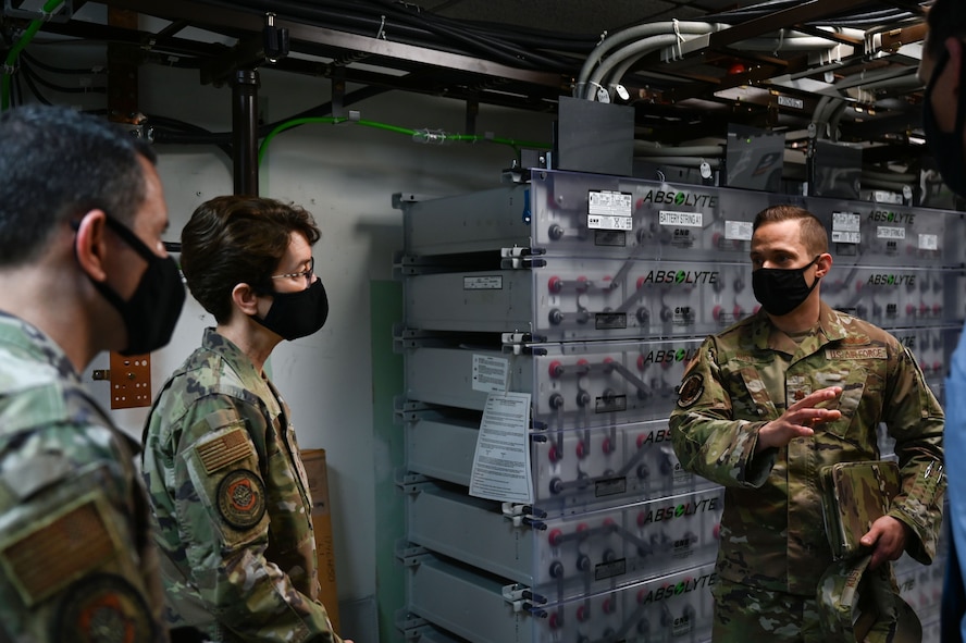 Airman talks to other Airmen.