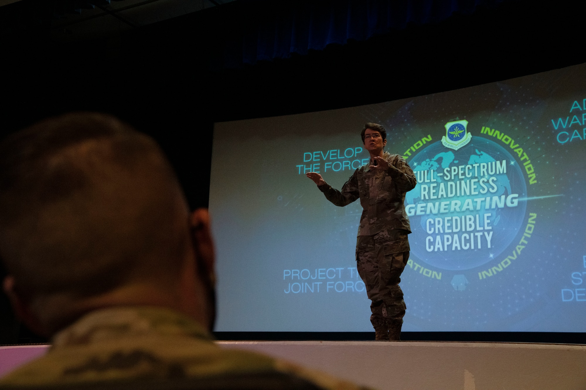 Woman stands on stage