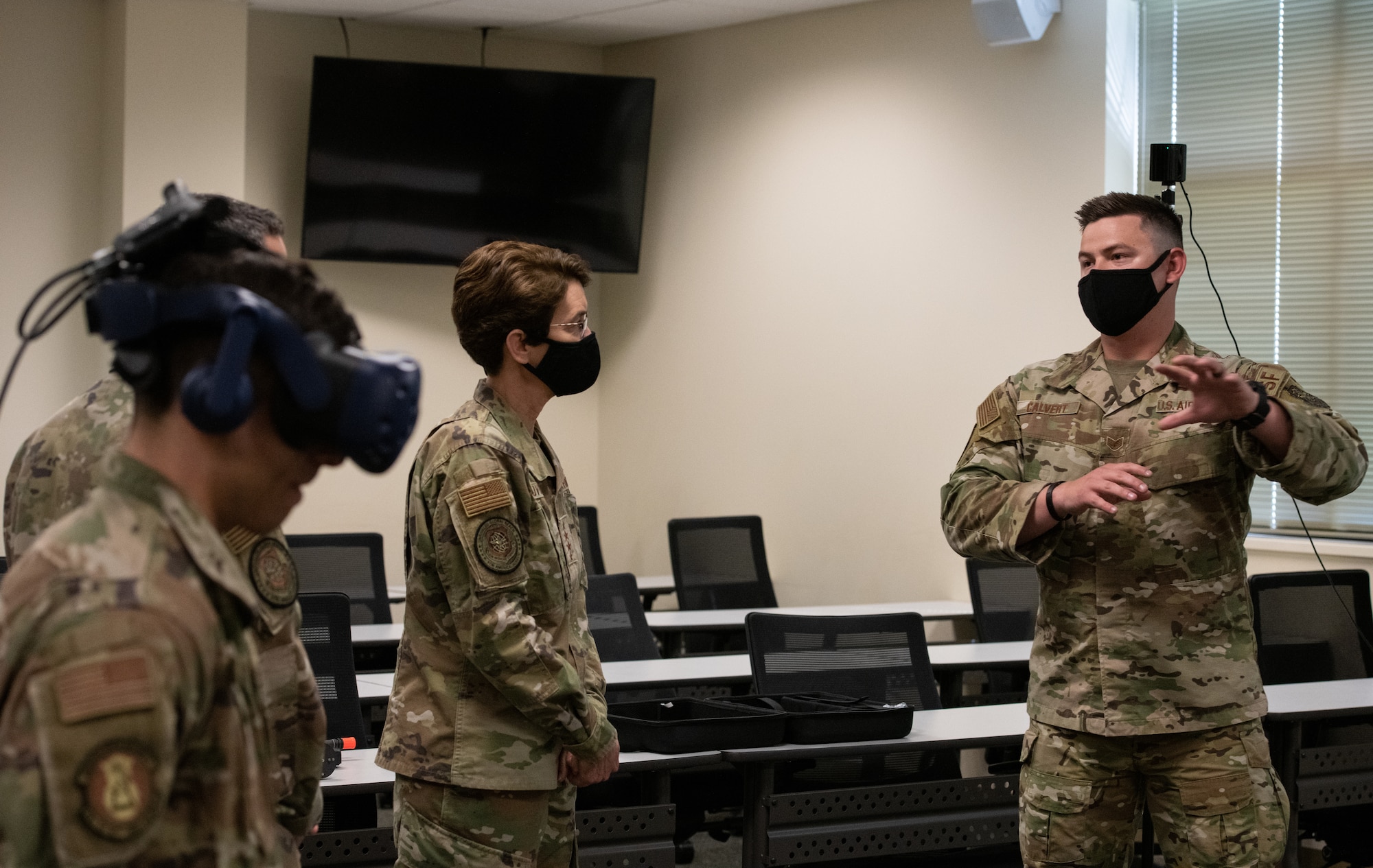 Man talks to Airmen.
