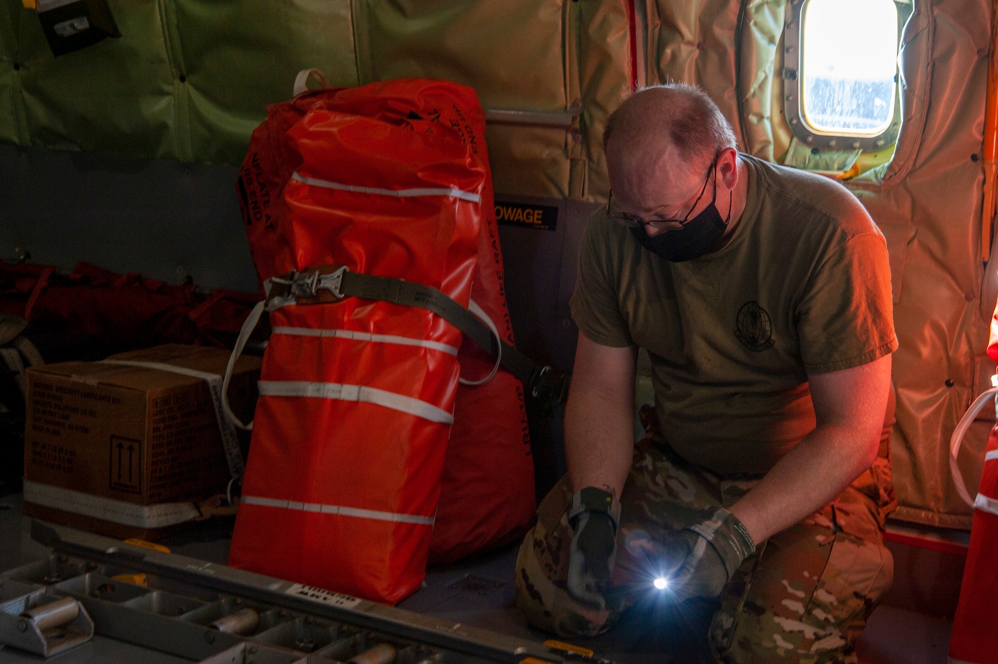 U.S. Air Force Tech. Sgt. Kris Schools, a 50th Air Refueling Squadron (ARS) boom operator instructor adjusts the mounting hardware for the cargo roller wheels on a KC-135 Stratotanker aircraft at MacDill Air Force Base, Fla., April 9, 2021, prior to a 91st ARS deployment. The rollers are checked prior to cargo being loaded which provides a safe way for airmen to move cargo around the aircraft. (U.S. Air Force photo by Airman 1st Class David D. McLoney)