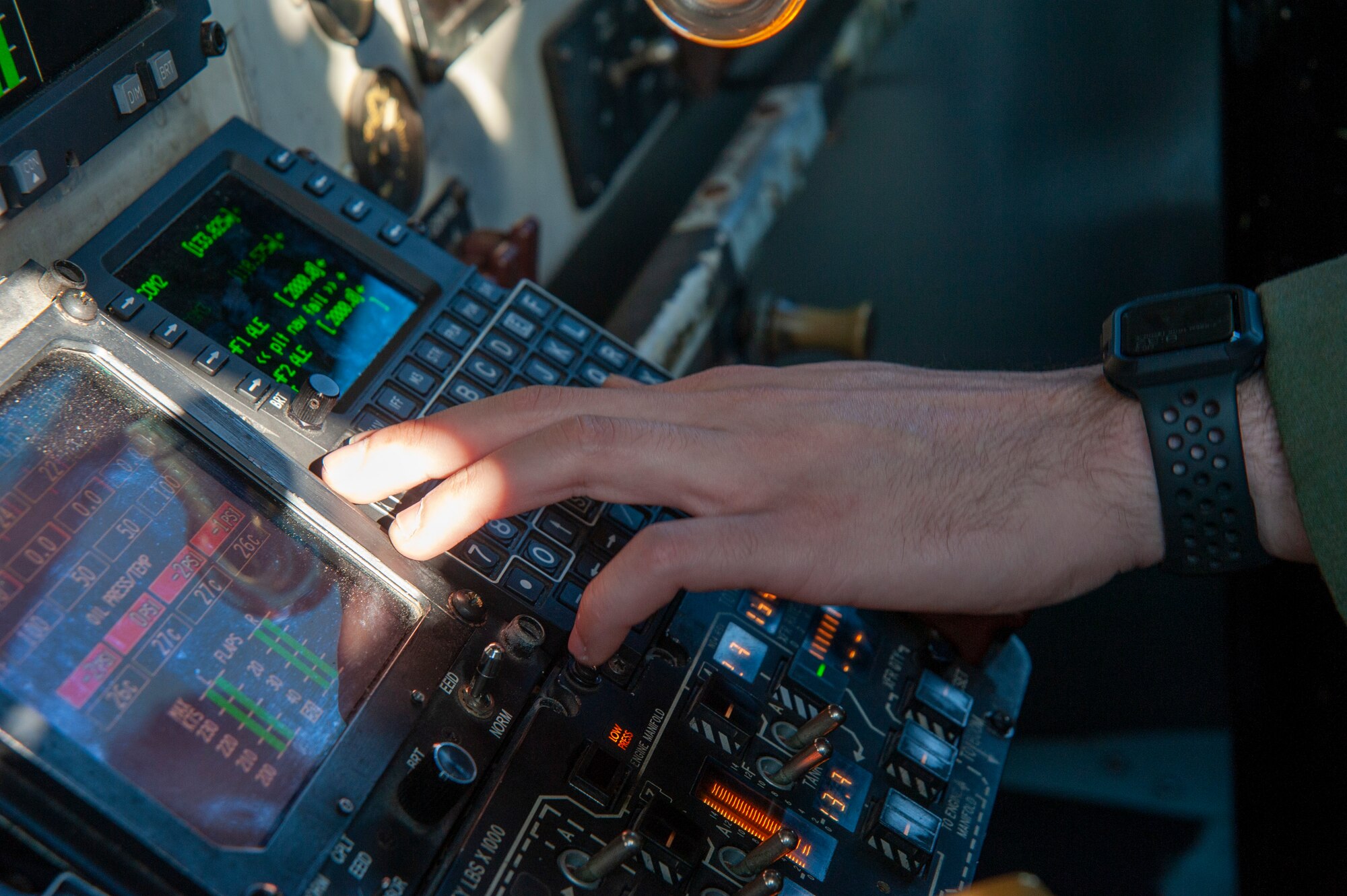 U.S. Air Force 1st Lt. Andres G. Velez, a 50th Air Refueling Squadron (ARS) pilot, programs flight information into a panel on a KC-135 Stratotanker aircraft, April 9, 2021, at MacDill Air Force Base, Fla., prior to a 91st ARS deployment. The panel is designed to keep track of flight navigation using a global positioning system and the destination is added prior to flight. (U.S. Air Force photo by Airman 1st Class David D. McLoney)