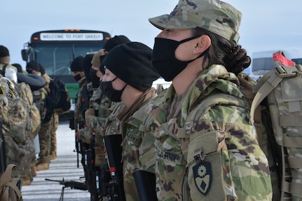 Soldiers with the California Army National Guard's 330th Military Police Company arrive at Fairbanks International Airport in Alaska March 30, 2021. The Soldiers will integrate with the Military Ground-based Interceptor Security Company, 49th Missile Defense Battalion, Alaska National Guard, at Fort Greely, to guard the expanding Missile Defense Complex.