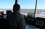 U.S. Air Force Staff Sgt. Monique Anazagasty, 325th Operations Support Squadron air traffic controller, looks out onto the flight line at Tyndall Air Force Base, Florida, April 13, 2021. Air traffic personnel and other aviation leaders take part in the Mid Air Collision Avoidance program, which is dedicated to keeping the Gulf Coast air space safe.  (U.S. Air Force photo by Airman 1st Class Anabel Del Valle)