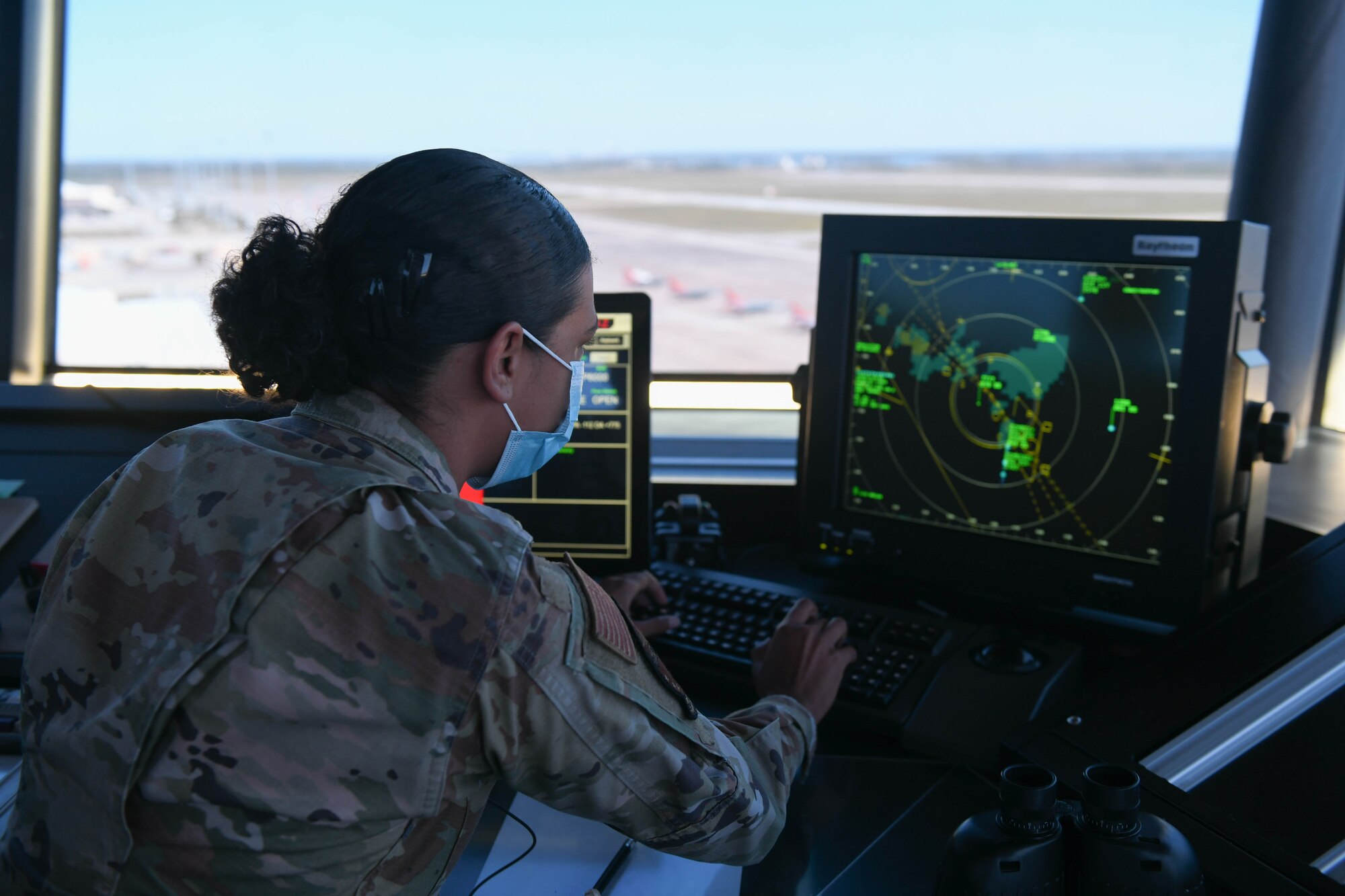 An Airman looks at a radar.