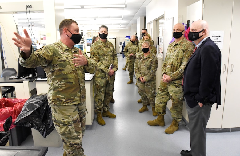 Acting Secretary of the Air Force John Roth, right, and Gen. Arnold W. Bunch Jr., commander, Air Force Materiel Command, listen to a presentation about the U.S. Air Force School of Aerospace Medicine Epidemiology Laboratory at Wright-Patterson Air Force Base, Ohio, March 23, 2021. The lab is responsible for analyzing a majority of the COVID-19 tests in the Air Force. Roth met with Air Force personnel and toured several facilities at the base including the National Air and Space Intelligence Center. (U.S. Air Force photo by Ty Greenlees)