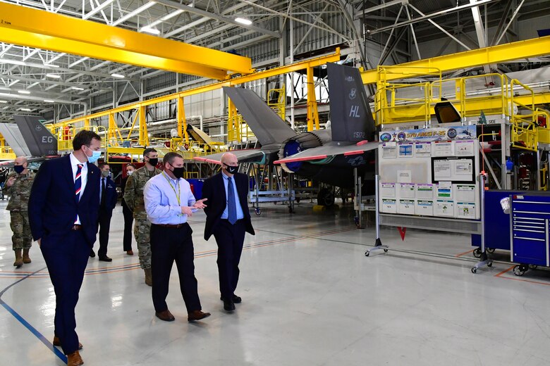 Shane Robertson (center), 570th Aircraft Maintenance Squadron director, briefs U.S. Rep. Blake Moore (left), R-Utah, and Acting Secretary of the Air Force John Roth during a visit to Hill Air Force Base, Utah, March 24, 2021. The visit was Roth's first to Hill as Acting SecAF, which included meetings with Airmen and Guardians from the 75th Air Base Wing, Ogden Air Logistics Complex, 388th Fighter Wing, Reserve 419th Fighter Wing, and Ground-Based Strategic Deterrent Systems Directorate. (U.S. Air Force photo by Todd Cromar)