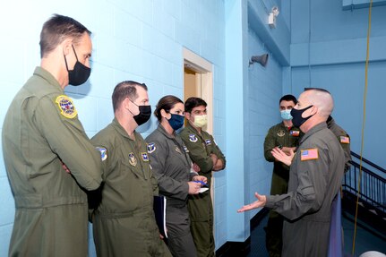 Chief Master Sgt. David Walsh, 433rd Operations Group superintendent, briefs 4th Air Force A3 team members during their visit to the 433rd Airlift Wing, April 9, 2021, at Joint Base San Antonio-Lackland, Texas. The team learned about specific mission sets and challenges the wing faces in training C-5M Super Galaxy aircrews. (U.S. Air Force photo by Tech. Sgt. Samantha Mathison)