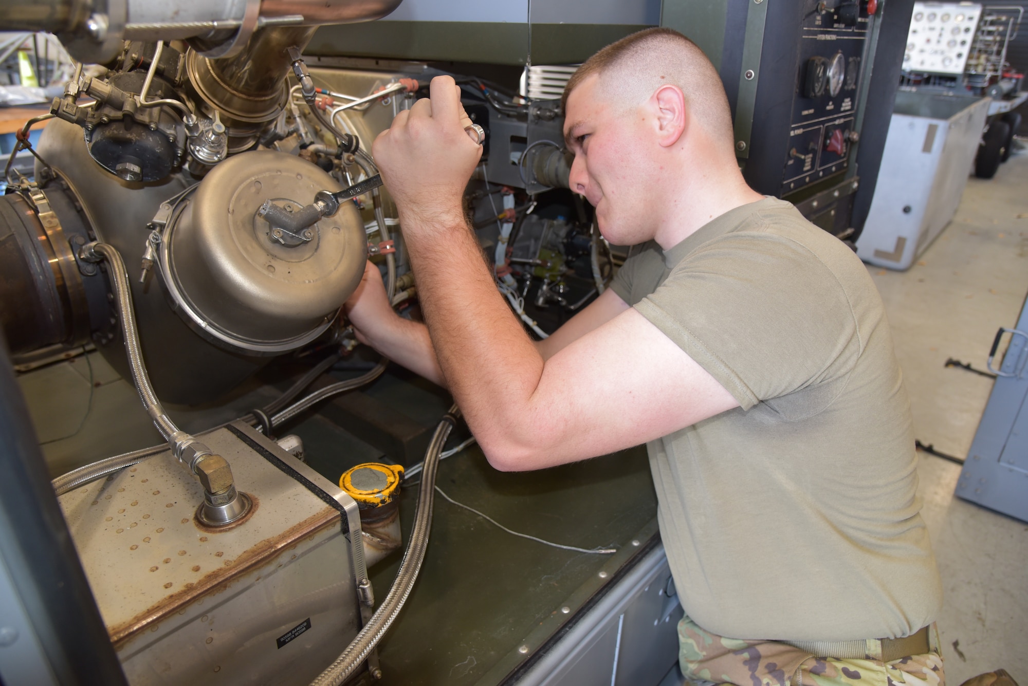 Senior Airman Connor Mason, Aerospace Ground Equipment craftsman assigned to the 403rd Maintenance Squadron, performs maintenance on a A/M32A-95 Turbine Compressor in the Roberts Consolidated Maintenance Facility, March 13, 2021, at Keesler Air Force Base, Mississippi. The AGE shop is responsible for the maintenance and repair of all ground equipment assigned to the 403rd Wing. (U.S. Air Force Photo by Tech Sgt. Michael Farrar)