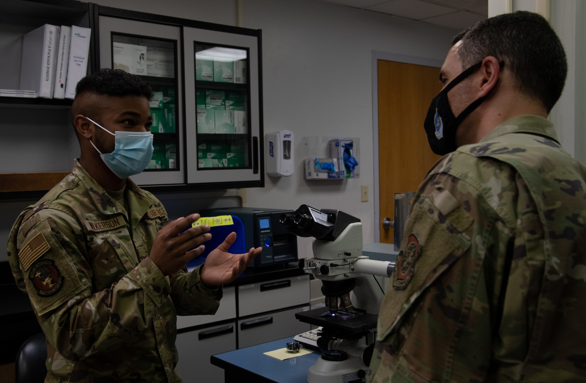 Airman talks to another Airman