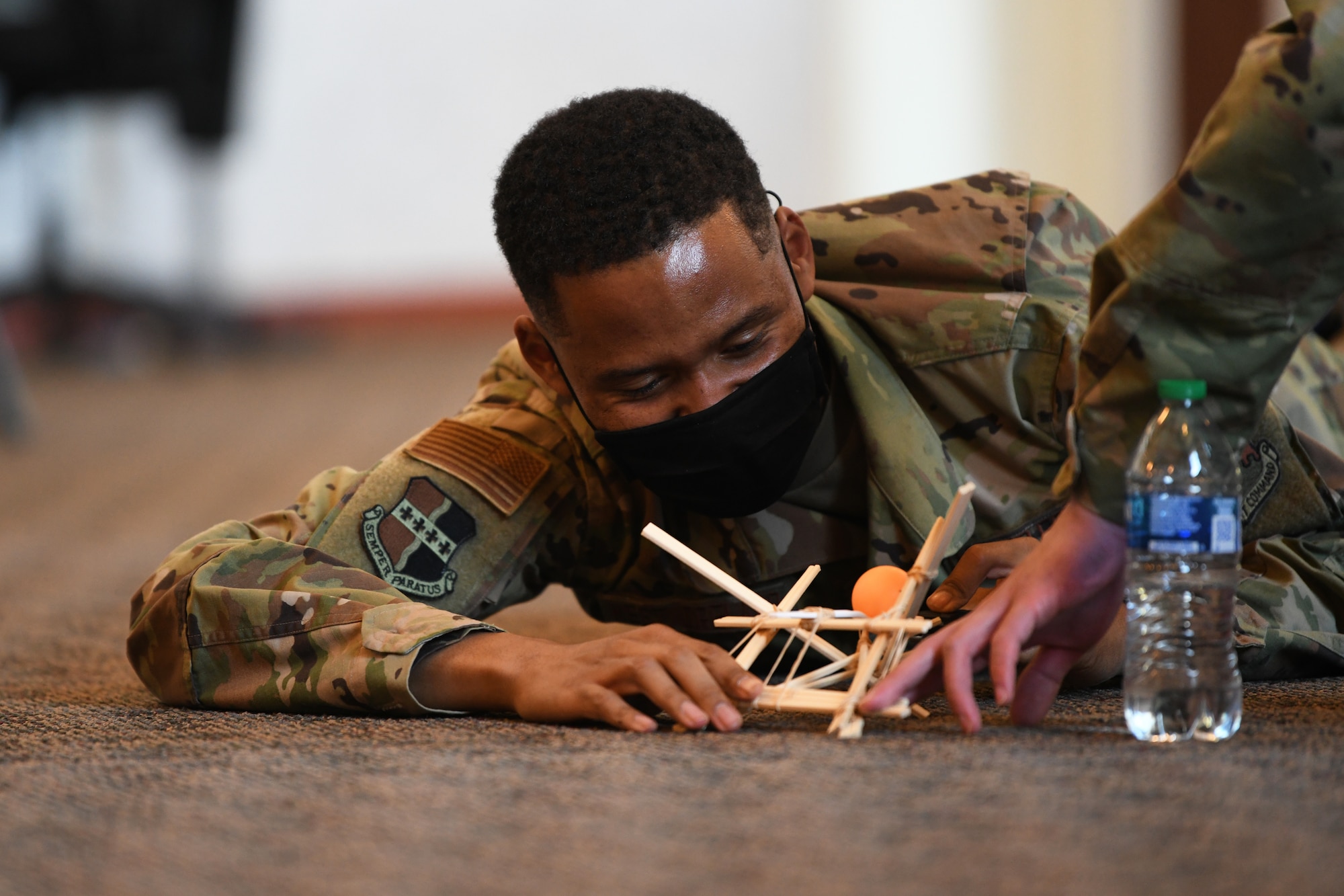 Airman 1st Class Brian Westmoreland, 9th Maintenance Squadron aircraft fuel systems specialist, prepares to launch a ball from a catapult during a teamwork-building exercise, March 29, 2021, at Beale Air Force Base California. The teamwork-building exercise was part of the Spiritual ISR(Intelligence Surveillance and Reconnaissance) Program. (U.S. Air Force photo by Airman 1st Class Luis A. Ruiz-Vazquez)