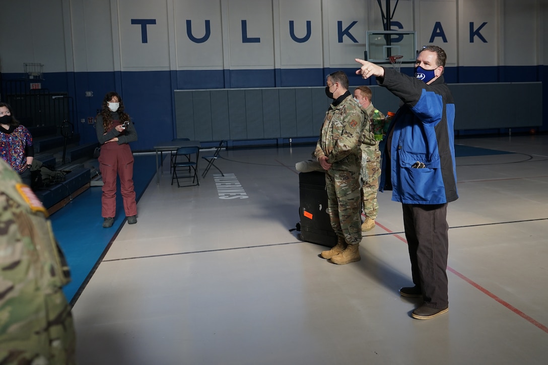 Members of the Alaska National Guard, along with members of the Alaska Department of Environmental Conservation, are introduced to the Tuluksak Tribal Council by Douglas Bushey, Principal of the Tuluksak School, Yupiit School District in Tuluksak, Alaska, April 8, 2021. Members of the Alaska Department of Military and Veterans Affairs, the Department of Environmental Conservation, and the Department of Commerce, Community, and Economic Development traveled to Western Alaska April 7-9 to meet with Tribal leaders and citizens in Bethel, Tuluksak, and Chevak to discuss disaster assistance measures and processes in light of recent emergencies that have occurred in the region, and in preparation for the upcoming flood season. (U.S. Army National Guard photo by Dana Rosso)