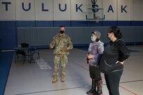 Maj. Gen. Torrence Saxe, commissioner for the Department of Military and Veterans Affairs and adjutant general of the Alaska National Guard, speaks to Kristy Napoka, Tribal Council secretary, treasurer, and utilities manager, and Elsie Allain, Tribal administrator, after presenting the State of Alaska Community Service Medal to each of them in Tuluksak, Alaska, April 8, 2021. Members of the Alaska Department of Military and Veterans Affairs, the Department of Environmental Conservation, and the Department of Commerce, Community, and Economic Development traveled to Western Alaska April 7-9 to meet with Tribal leaders and citizens in Bethel, Tuluksak, and Chevak to discuss disaster assistance measures and processes in light of recent emergencies that have occurred in the region, and in preparation for the upcoming flood season. (U.S. Army National Guard photo by Dana Rosso)