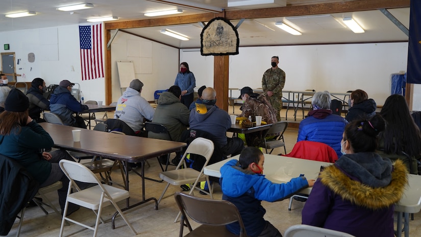 Maj. Gen. Torrence Saxe, commissioner for the Department of Military and Veterans Affairs and adjutant general of the Alaska National Guard, and Sandra Moller, State of Alaska Department of Commerce, Community & Economic Development, speak with Chevak community members during a townhall meeting held at the Chevak City Office in Chevak, Alaska, April 9, 2021. Members of the Alaska Department of Military and Veterans Affairs, the Department of Environmental Conservation, and the Department of Commerce, Community, and Economic Development traveled to Western Alaska April 7-9 to meet with Tribal leaders and citizens in Bethel, Tuluksak, and Chevak to discuss disaster assistance measures and processes in light of recent emergencies that have occurred in the region, and in preparation for the upcoming flood season. (U.S. Army National Guard photo by Dana Rosso)