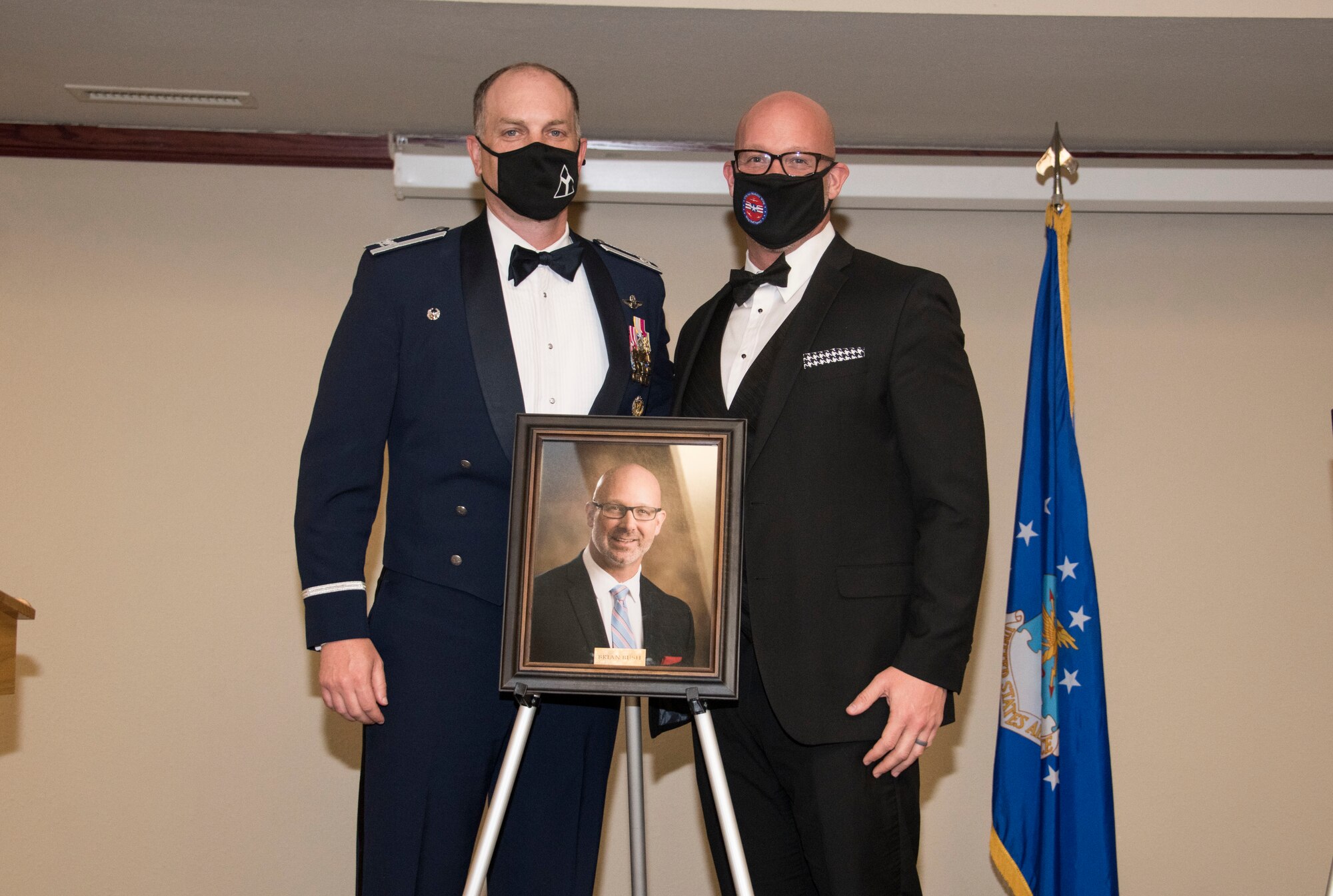 From left, Col. Matthew Leard, 97th Air Mobility Wing commander, and Brian Bush, Altus Air Force Base housing advocate, pose for a photo during a Friends of Altus induction ceremony on April 9, 2020, at Altus Air Force Base, Oklahoma. Bush was selected by Leard to become a Friend of Altus for his efforts in supporting the local community, Airmen and their families. (U.S. Air Force photo by Airman 1st Class Amanda Lovelace)