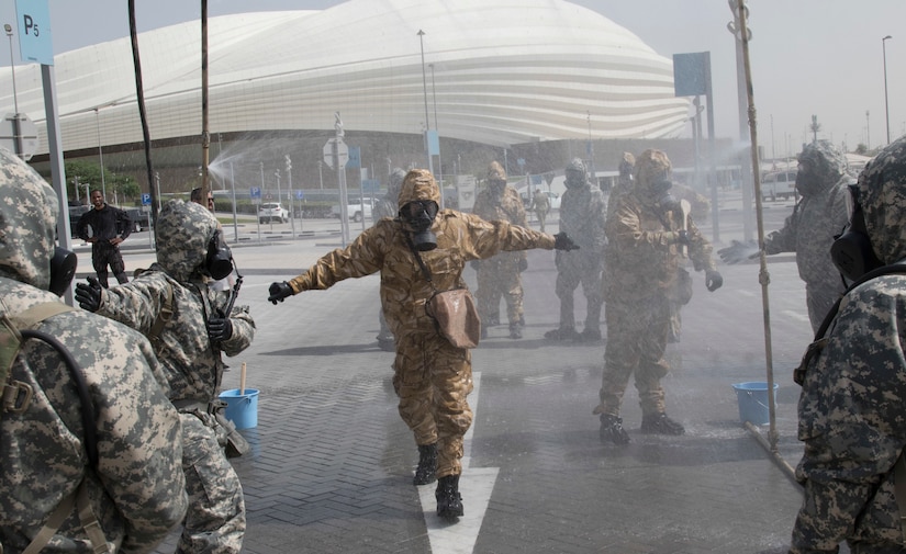 U.S. Army Soldiers from 318th Chemical Company, 1st Battalion, 35th Armored Regiment, 2nd Brigade, 1st Armored Division, Task Force Spartan, decontaminate a Qatari soldier in a simulated crisis scenario during Invincible Sentry, March 23, 2021, near Doha, Qatar. U.S. Central Command’s annual bilateral exercise allows the U.S. and Qatar to work together toward prevailing against complex regional security challenges. (U.S. Army photo by Staff Sgt. Daryl Bradford, Task Force Spartan Public Affairs)