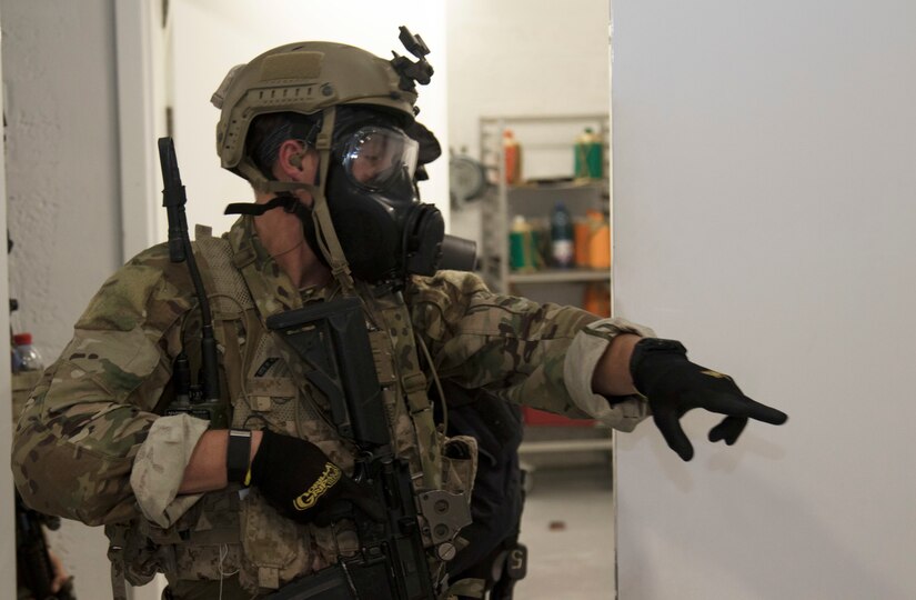 A U.S. Special Operations Forces member points to an objective used in simulated crisis scenario during exercise Invincible Sentry, March 23, 2021, near Doha, Qatar. U.S. Central Command’s annual bilateral exercise enables U.S. and Qatar to work together toward prevailing against complex regional security challenges. (U.S. Army photo by Staff Sgt. Daryl Bradford, Task Force Spartan Public Affairs)