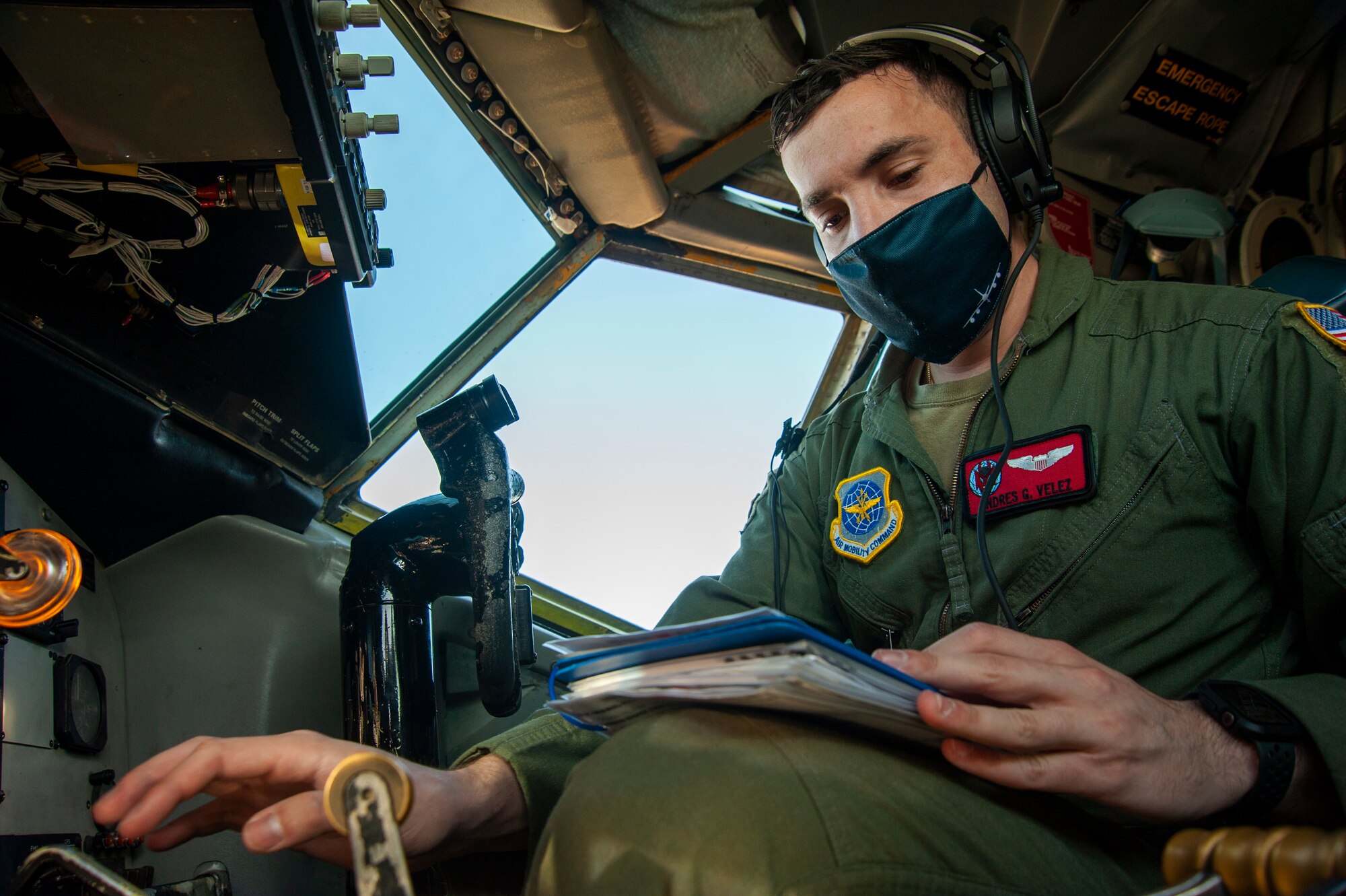 U.S. Air Force 1st Lt. Andres G. Velez, a 50th Air Refueling Squadron (ARS) pilot, reads the long format checklist binder while performing a preflight check on a KC-135 Stratotanker aircraft, at MacDill Air Force Base, Fla., April 9, 2021 prior to a 91st ARS deployment. 
Airmen from the 50th ARS completed pre-deployment measures for deploying 91st ARS Airmen to help reduce the burden of certain preparations before the 91st flew to their deployed location. (U.S. Air Force photo by Airman 1st Class David D. McLoney)