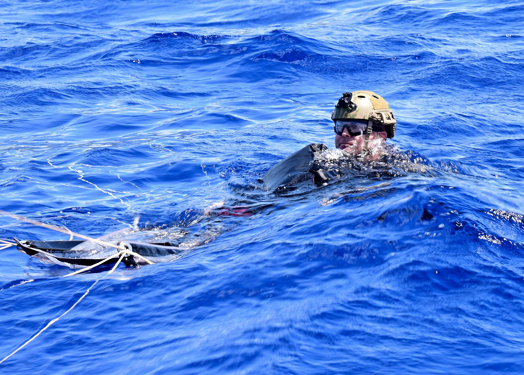 A Navy SEAL and his parachute land in the water