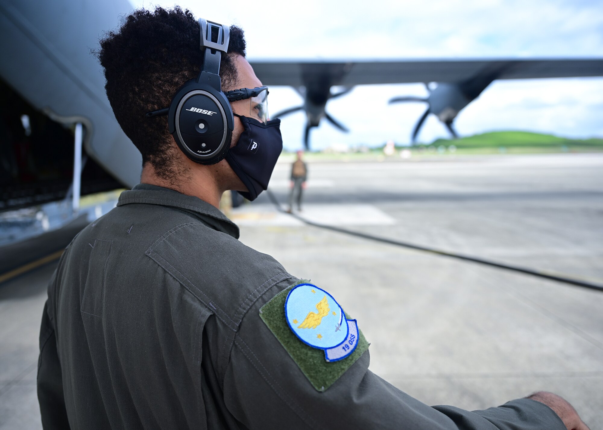 An Airman watches as a wet-wing defuel is performed on an aircraft.