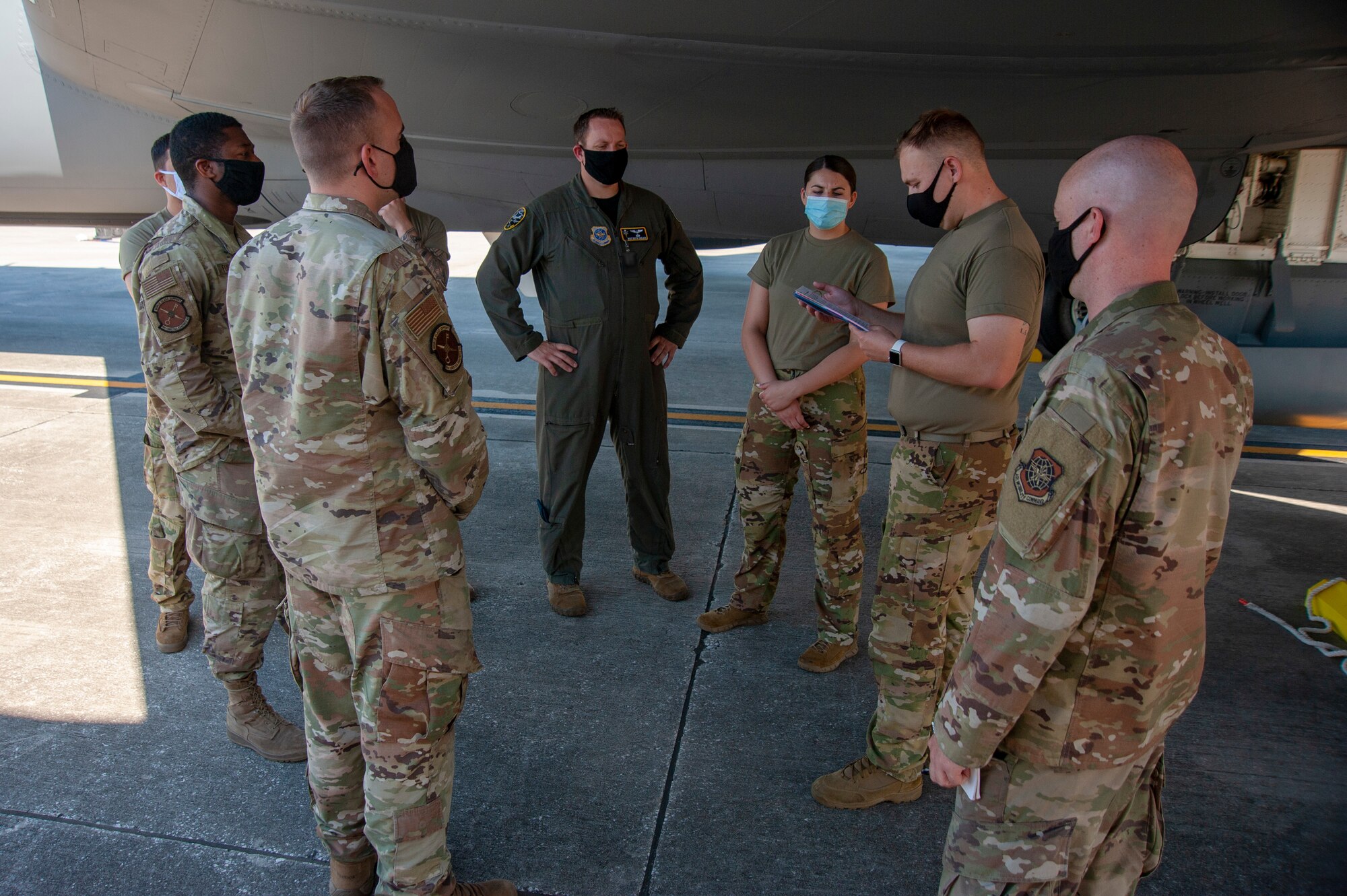 U.S. Air Force Airman 1st Class Tristan Shannon, a 91st Air Refueling Squadron boom operator, provides a safety brief to the cargo load team prior to loading a KC-135 Stratotanker, April 9, 2021, at MacDill Air Force Base. 6th Air Refueling Wing teams must discuss all plans before loading and unloading an aircraft. (U.S. Air Force photo by Airman 1st Class David D. McLoney)