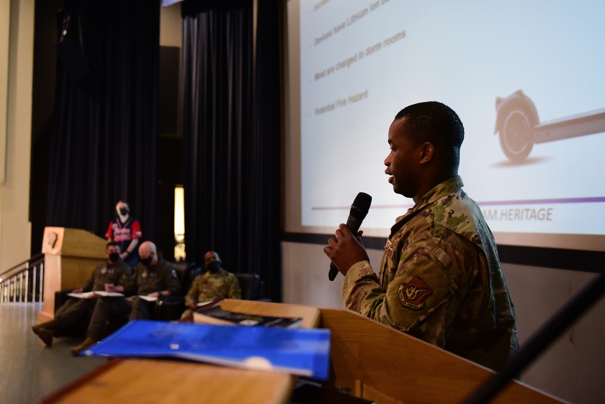 Staff Sgt. Thierry Etienne, 8th Civil Engineer Squadron dorm manager, briefs about a solar charging station during a Wolf Tank at Kunsan Air Base, Republic of Korea, April 9, 2021. The stations would offer Airmen a safe place outside of the dorms to charge their electric scooters. Wing leadership funded three of the five ideas that were presented, which included a wireless intercom system, an inner ear bone conducting headset, and hardened aircraft system GPS repeaters. (U.S. Air Force photo by Senior Airman Suzie Plotnikov)