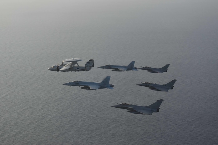 210413-N-NO712-1115 ARABIAN SEA (April 13, 2021) - U.S. Navy F/A-18F and F/A-18E Super Hornet fighter jets, an E-2C Hawkeye tactical airborne early warning aircraft and French Marine Nationale Dassault Rafale fighter jets fly in formation during dual carrier operations between the aircraft carriers USS Dwight D. Eisenhower (CVN 69) and FS Charles de Gaulle (R 91) in the Arabian Sea, April 13. The Eisenhower Carrier Strike Group is deployed to the U.S. 5th Fleet area of operations in support of naval operations to ensure maritime stability and security in the Central Region, connecting the Mediterranean and Pacific through the western Indian Ocean and three strategic choke points. (U.S. Navy Photo)