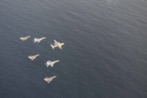 210413-N-NO712-1188 ARABIAN SEA (April 13, 2021) - U.S. Navy F/A-18F and F/A-18E Super Hornet fighter jets, an E-2C Hawkeye tactical airborne early warning aircraft and French Marine Nationale Dassault Rafale fighter jets fly in formation during dual carrier operations between the aircraft carriers USS Dwight D. Eisenhower (CVN 69) and FS Charles de Gaulle (R 91) in the Arabian Sea, April 13. The Eisenhower Carrier Strike Group is deployed to the U.S. 5th Fleet area of operations in support of naval operations to ensure maritime stability and security in the Central Region, connecting the Mediterranean and Pacific through the western Indian Ocean and three strategic choke points. (U.S. Navy Photo)