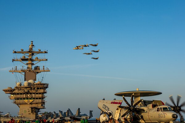 U.S. Navy and French navy aircraft fly in formation during dual carrier operations between USS Dwight D. Eisenhower (CVN 69) and FS Charles de Gaulle (R 91) in the Arabian Sea.